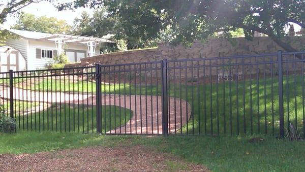 Block retaining wall pathway and fencing