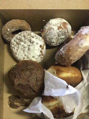 Boston cream, powdered jelly, glazed, cinnamon sugar and an apple fritter.