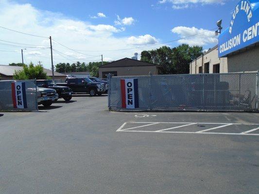 Back lot entrance on the left side of the building.