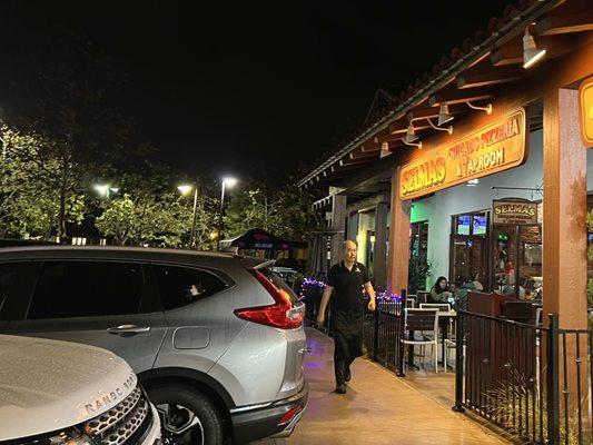 Exterior with a dining patio. Parking lot near the restaurant was full when I picked up my order, but there are pick up parking spots.