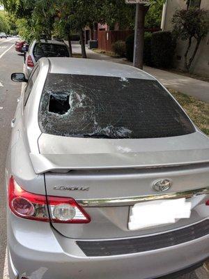 Before: a bicyclist falls into my parked car's rear windshield.