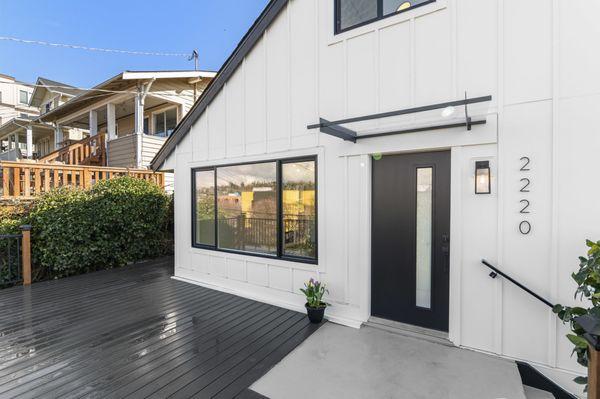 This Queen Anne home underwent a stunning transformation- New Hardie siding was installed along with sleek black Milgard windows