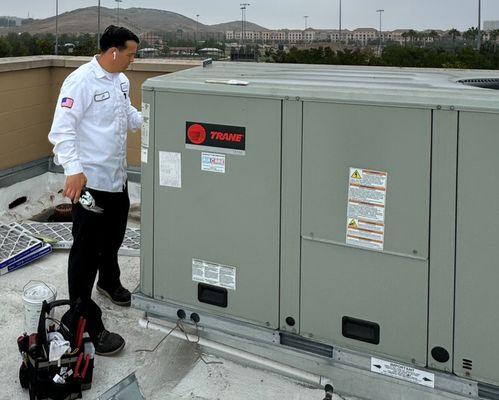 Air Care tech working on a commercial 6 ton packaged unit.