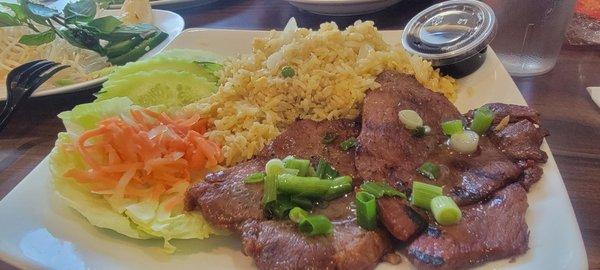 Vegetables fried rice with salad and pork chops and soy sauce