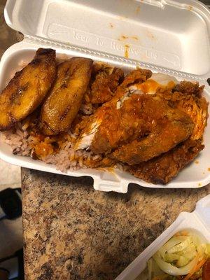 Small fried chicken with sauce, rice and pease, and plantain