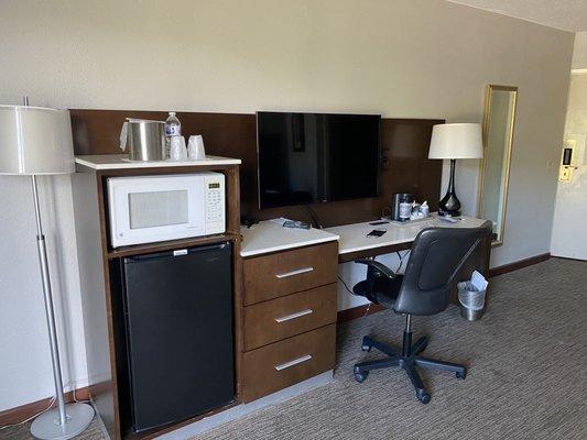 Tv, desk and mini fridge