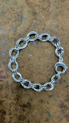 This is a uniquely hand made double links bracelet, in sterling silver.