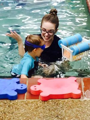 This is my son with Ms. Emily, his teacher. He used to scream and cry during class because he had a fear of drowning. Now look at him!