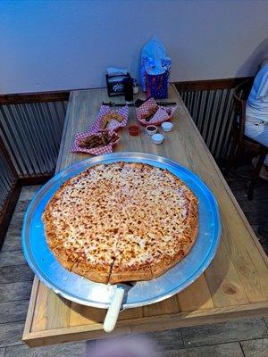 Biggest pizza I've eaten.. makes the table look small.