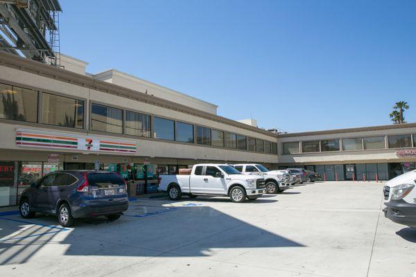 Entrances to large parking lot on both Ventura Blvd and Orion Ave