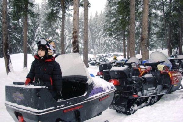 My son was so little when we first came here in Bear Valley for Snowmobile . They have  a cart to attach to our snowmobile .