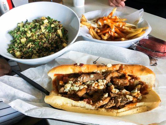 Tri-tip steak sandwich, kale and wild rice salad, Buffalo bleu fries