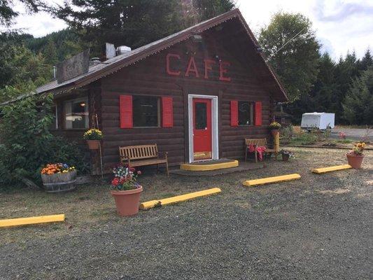 Bless Your Heart Baking (bakery and cafe) is housed in adorable log cabin building with a cheery cafe interior.