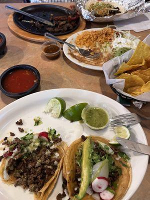 Carne Asada tacos, steak fajitas, chips, etc.  Pic taken halfway thru meal.