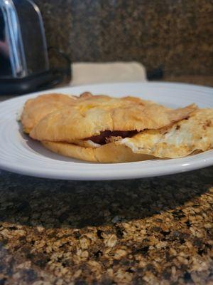 Flat croissant breakfast sandwich