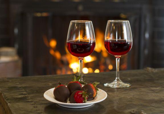 Enjoy a bottle of local wine and indulge in chocolate covered strawberries next to the cozy fire.