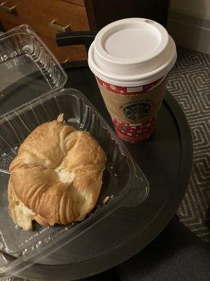 Croissant breakfast sandwich with egg and Swiss, medium skim latte