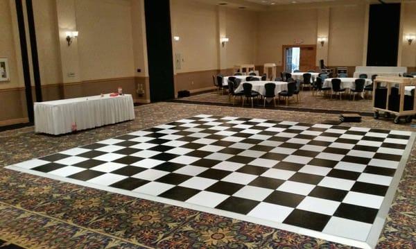 Black, white or wood grain dance floors available from A Chair Affair, Inc.