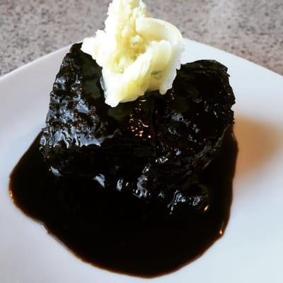 Braised Short Rib in a Demi Glace topped with a white rose of Bone Marrow