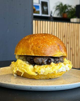 "Sandwich 2" -  eggs, blueberry breakfast sausage, maple rosemary drizzle, sweet potato brioche bun