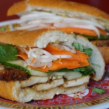 Lemongrass Tofu Banh Mi, w/ house garlic aioli, house marinade, pickled carrots, bean sprouts, cilantro, & more. Request no aioli for vegan.