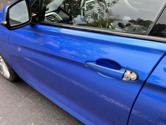 Driver door, how car was returned to me. Missing trim over lock)