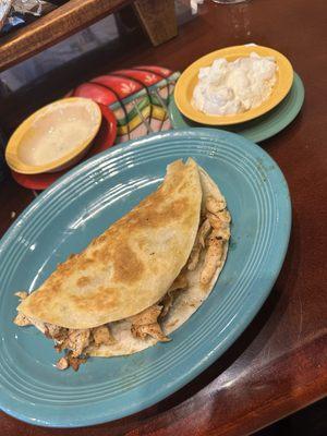 Chicken quesadilla Al la carte with sour cream and queso in the background  Sour Cream Cheese Dip