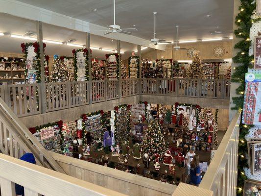 Two levels of Christmas ornaments and decor