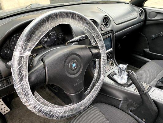 The steering wheel and shifter coverings. The seat covering was removed just before I got in.