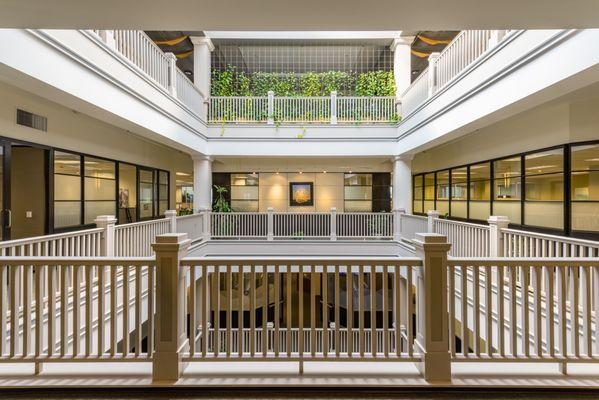 A large atrium open to four floors and a mezzanine.