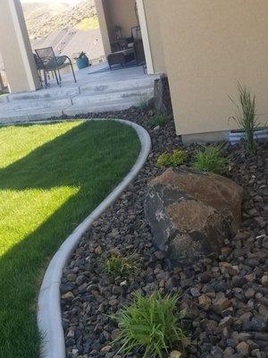 Using boulders to add character to property.