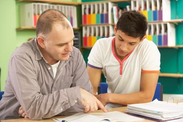 Focusing on improving test scores with his tutor