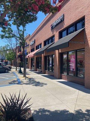 Another exterior view -- Sally Beauty Supply & Travis Credit Union next door as one heads toward Peet's Coffee & Movie Theatre.