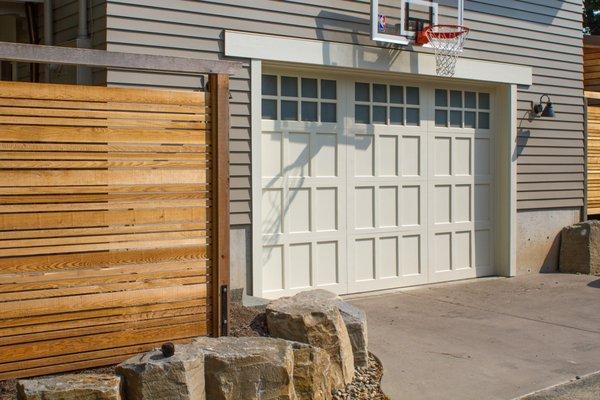 Our hand built Portland Carriage Collection custom wood door - shown in the Piedmont design with 24 windows.