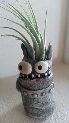 My air plant + funky little creature planter.