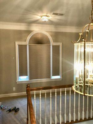 Cellular shades with arch, also blackout shade behind plantation shutter for maximum light blocking- Pinnacle 615-544-2510