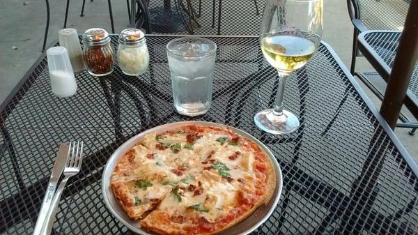 Individual pizza with chicken, feta, sundried tomatoes, and spinach.  My own creation!