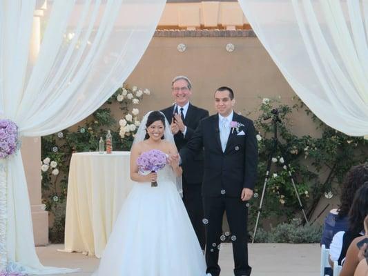 Pastor Deghi officiating our wedding at the Aliso Viejo Conference Center.