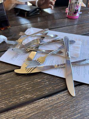 This is how they presented us with our flatware....dumped on the table in a random amount. This was for 3 people, btw.