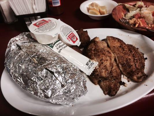 Blackened catfish, hush puppies and baked potato