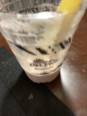 The sharp object on the picture under the cup looking like a peace of glass with 3 very sharp edges is what was inside the drink