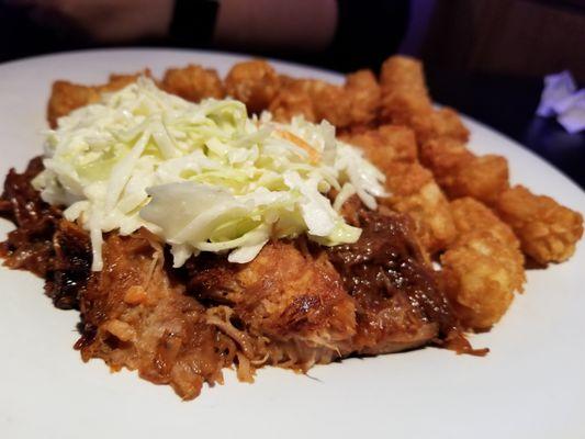 Pulled Pork (minus the bun) topped with coleslaw and a side of tater tots