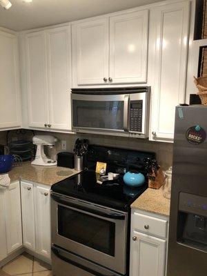 Resurfaced these cabinets from a natural oak color to a high gloss white on a fire rebuild!