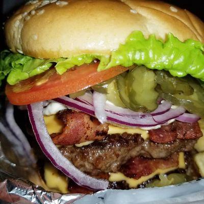 Burgers: Raggedy Burger topped w/ Bacon, Cheese, and a Fried Egg w/ lettuce, tomatoes, pickles, & red onions, mayo, mustard, & ketchup.