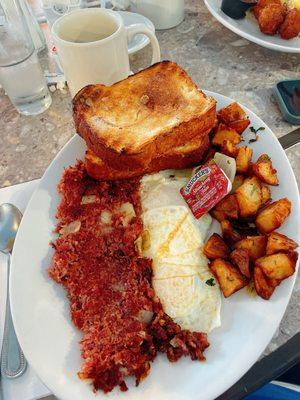 Hash Breakfast with eggs over easy and cinnamon toast