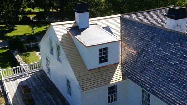 Alaskan Yellow Cedar Shingle Roof as well as EPDM Single ply rubber roof,trimmed out with copper drip edge metal