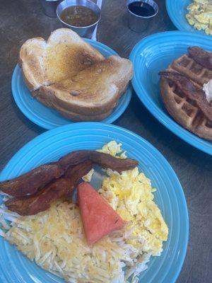 1 scrambled egg, 2 Bacon Strip, Hash Browns, sour dough toast.