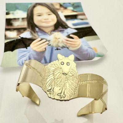 Grand child's artwork of a bat transformed into a 18k gold bangle bracelet!