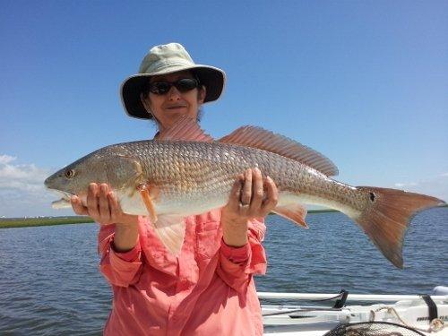 Lady Angler really enjoys Red Drum Fishing !