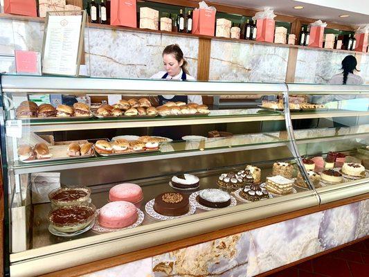 Bakery display case of sandwiches, cakes, cookies & tarts. Got good quick service with no issues.